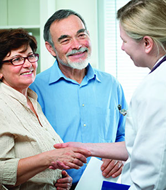 A family doctor counseling a senior couple A family doctor counseling a senior couple on general health matters