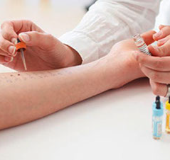 hands of a treating physician and the treated hand of a patient