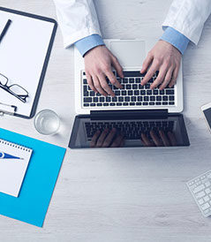 An image of a Family Doctor's desk while recording the examination findings