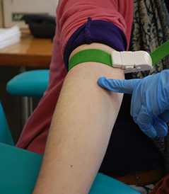 Image of a patient's arm prepared for giving blood samples for blood analysis Image of a patient's arm prepared for giving blood samples for blood analysis