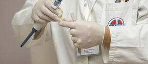 Treatment Physician fitting his surgical gloves Treatment Physician fitting his surgical gloves