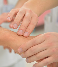 Close-up of a procedure of taking the pulse of a young patient by touching one of the main vein Close-up of a procedure of taking the pulse of a young patient by touching one of the main vein