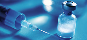 Close-up of a seringe's needle and an antibiotic ampulla Close-up of a seringe's needle and an antibiotic ampulla