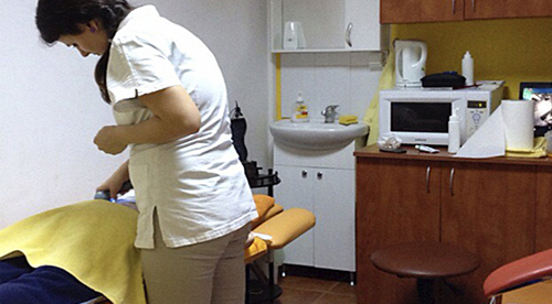 Massage session at the "Dr. Vaetisi" Center with the patient on a streching bad Massage session at the "Dr. Vaetisi" Center with the patient on a streching bad